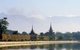 Burma / Myanmar: Early morning smoke and haze over Mandalay Fort with the Shan Plateau visible in the background