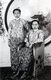 Malaysia / Singapore: Two young Nyonya women in traditional clothing, c. 1940s